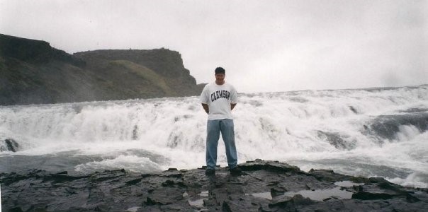 Helgi at beach in Clemson shirt